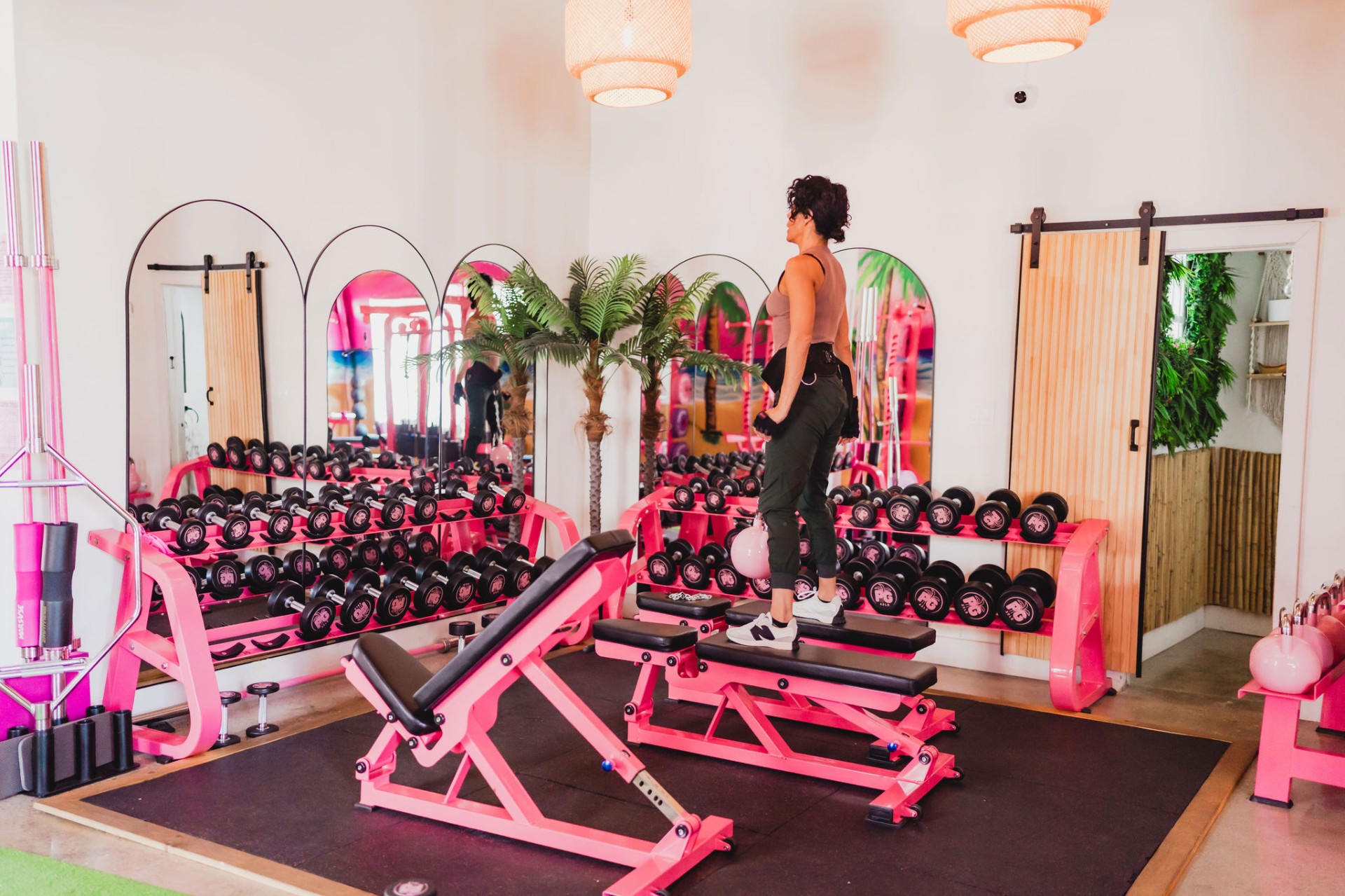 Pink dumbbell room with bench